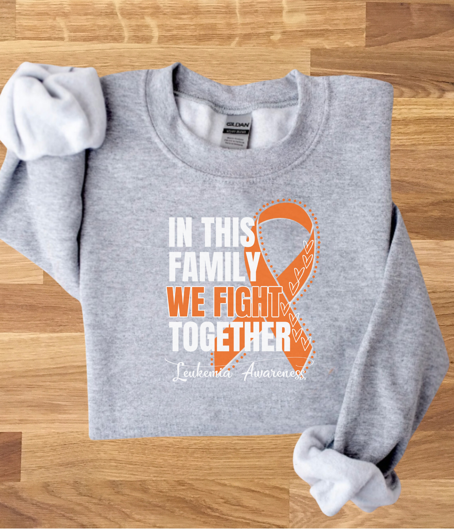 a gray shirt with an orange ribbon on it