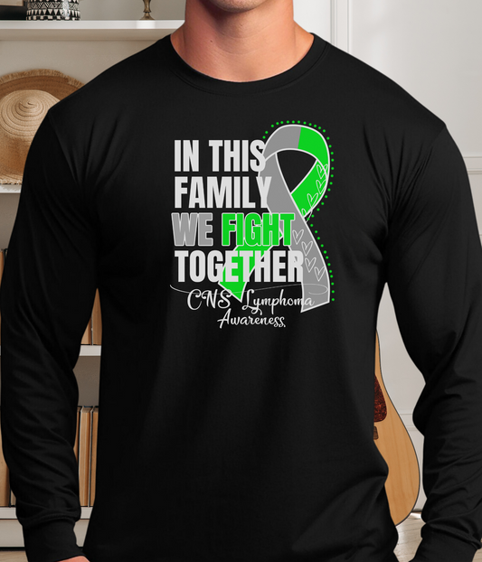 a man wearing a black shirt with a green ribbon on it