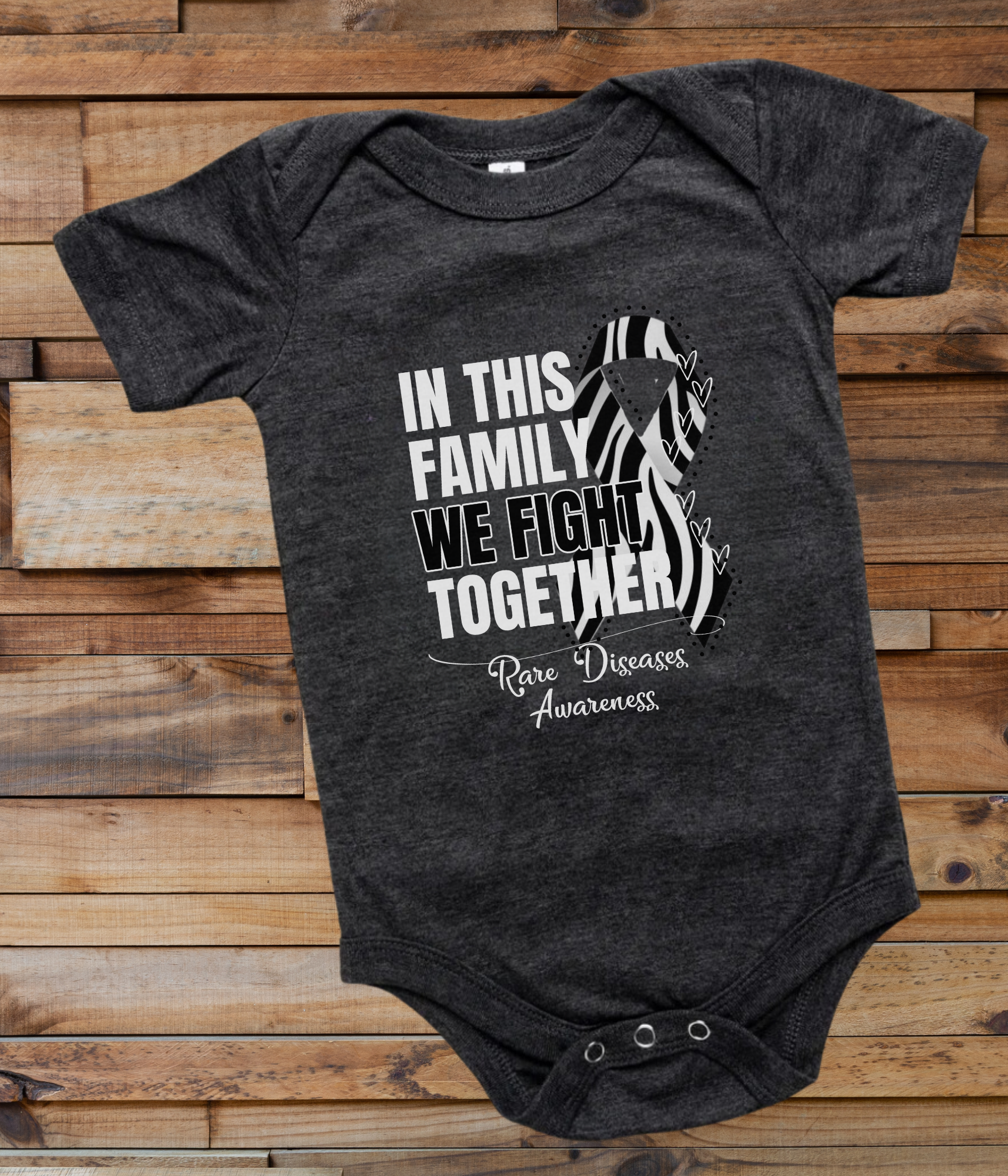 a black onesuit with a picture of a zebra in this family we fight together