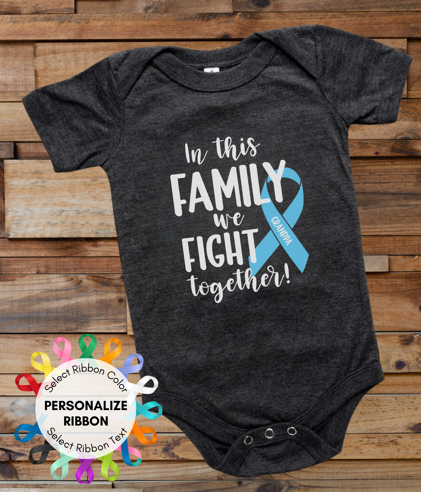 a black onesuit with a blue ribbon on it and the words in this family
