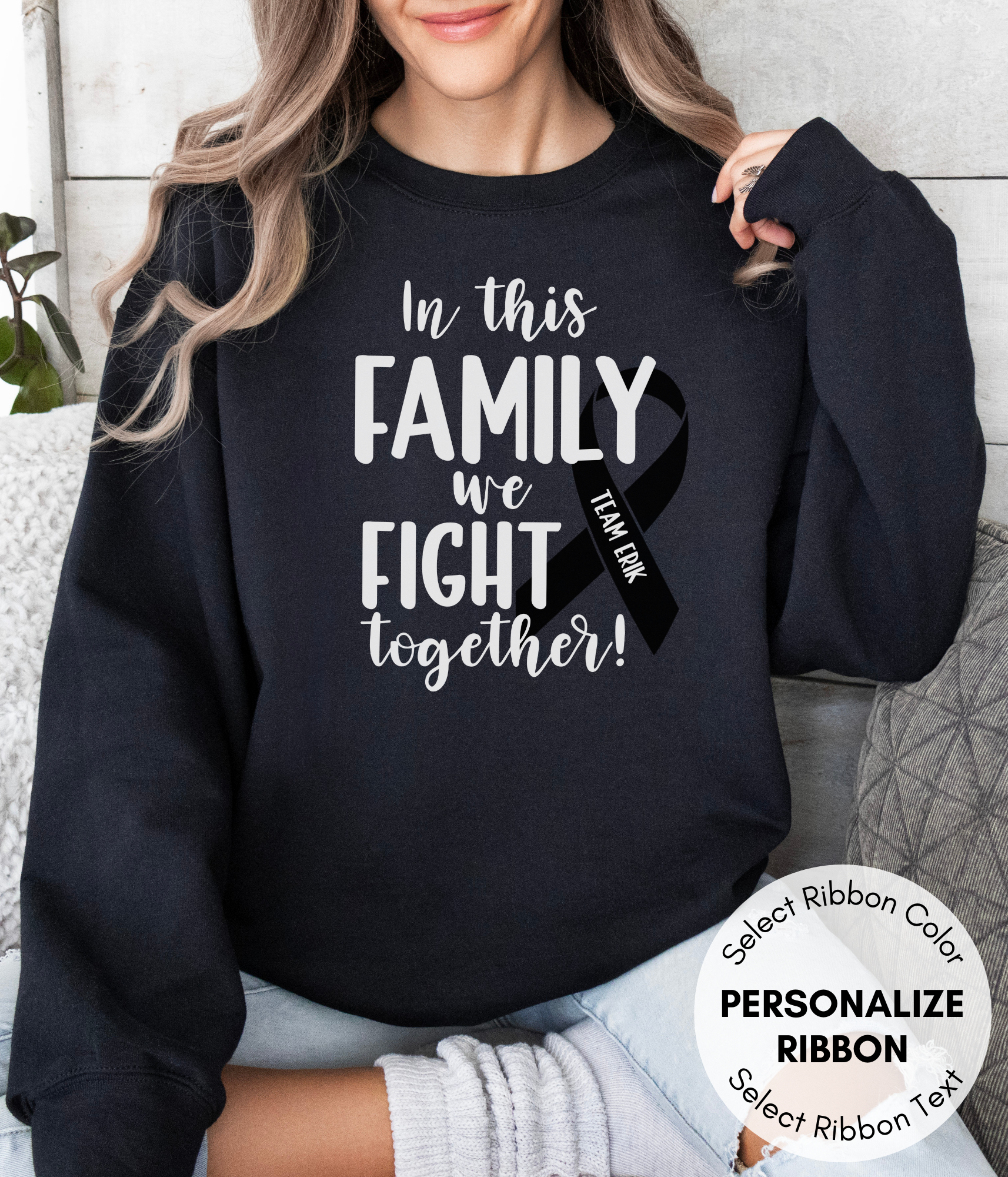 a woman wearing a black sweatshirt that says in this family we fight together