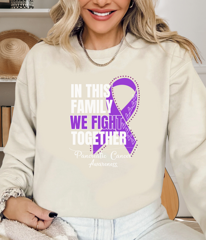 a woman wearing a sweatshirt with a purple ribbon on it