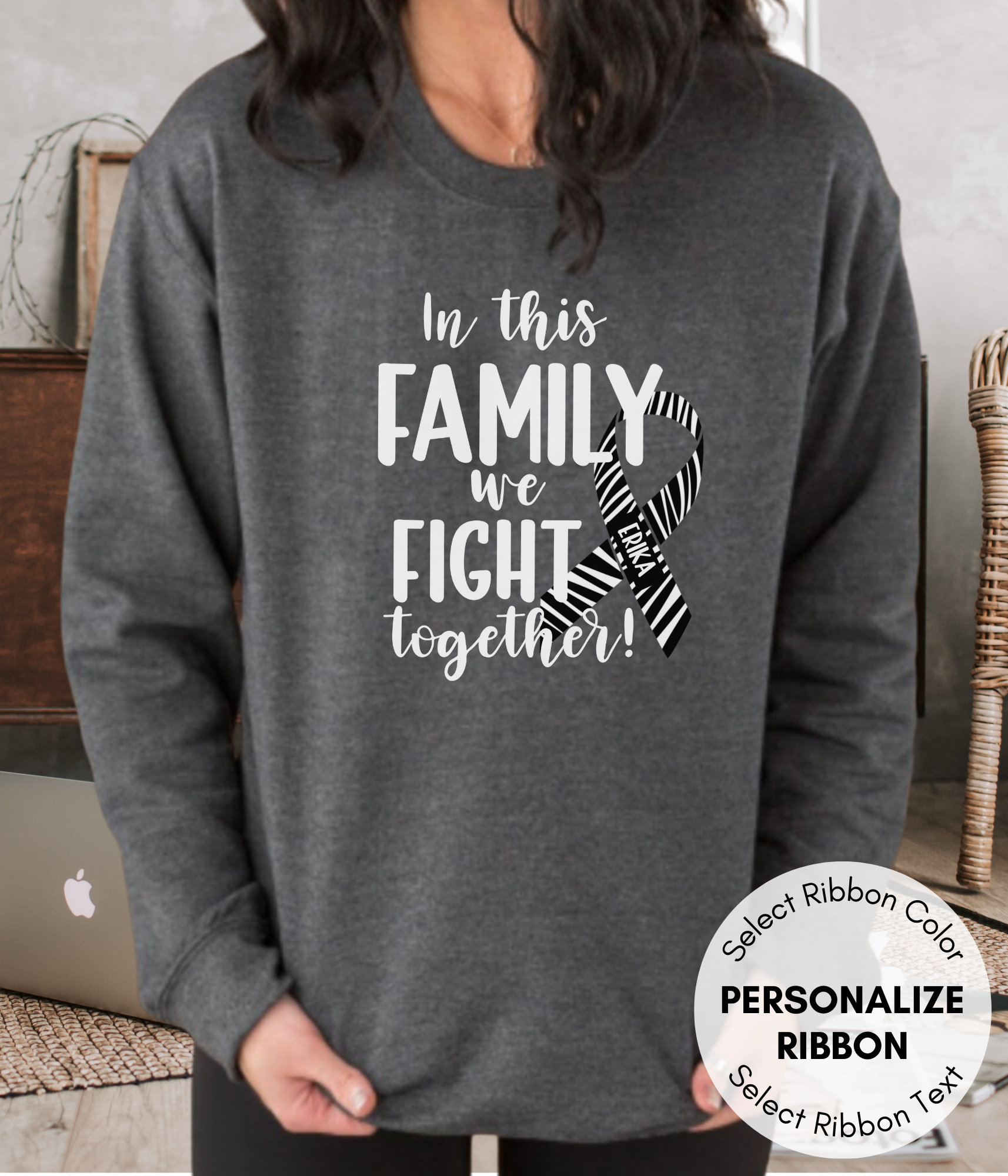 a woman wearing a sweatshirt that says in this family we fight together