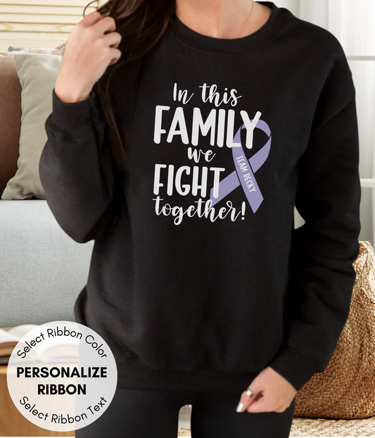 a woman wearing a sweatshirt that says, in this family we fight together