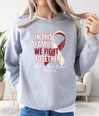 a woman wearing a sweatshirt that says in this family we fight together