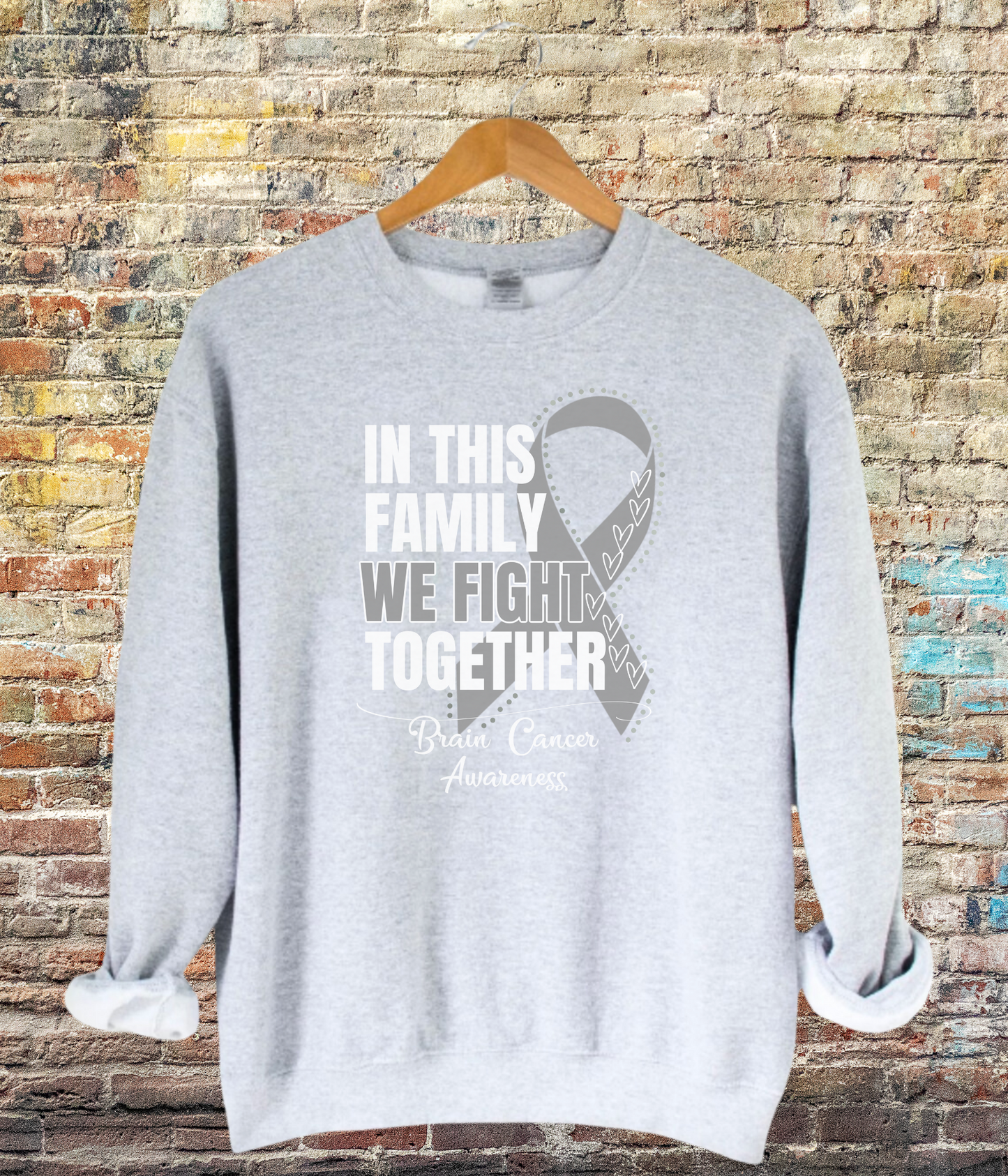 a grey sweatshirt with a ribbon on it that says in this family we fight together