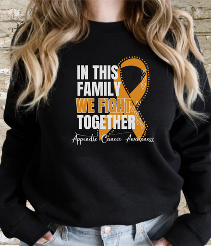 a woman wearing a black sweatshirt with an orange ribbon in this family we fight together