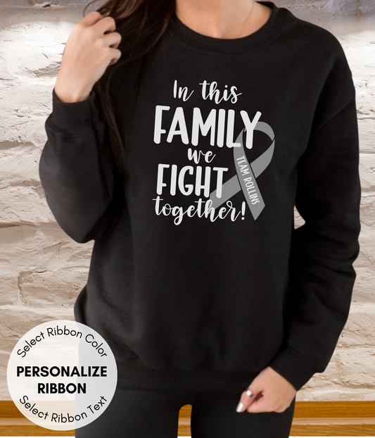a woman wearing a black sweatshirt that says, in this family we fight together