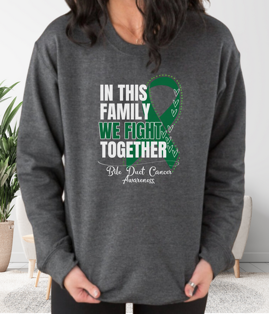 a woman wearing a sweatshirt that says in this family we fight together