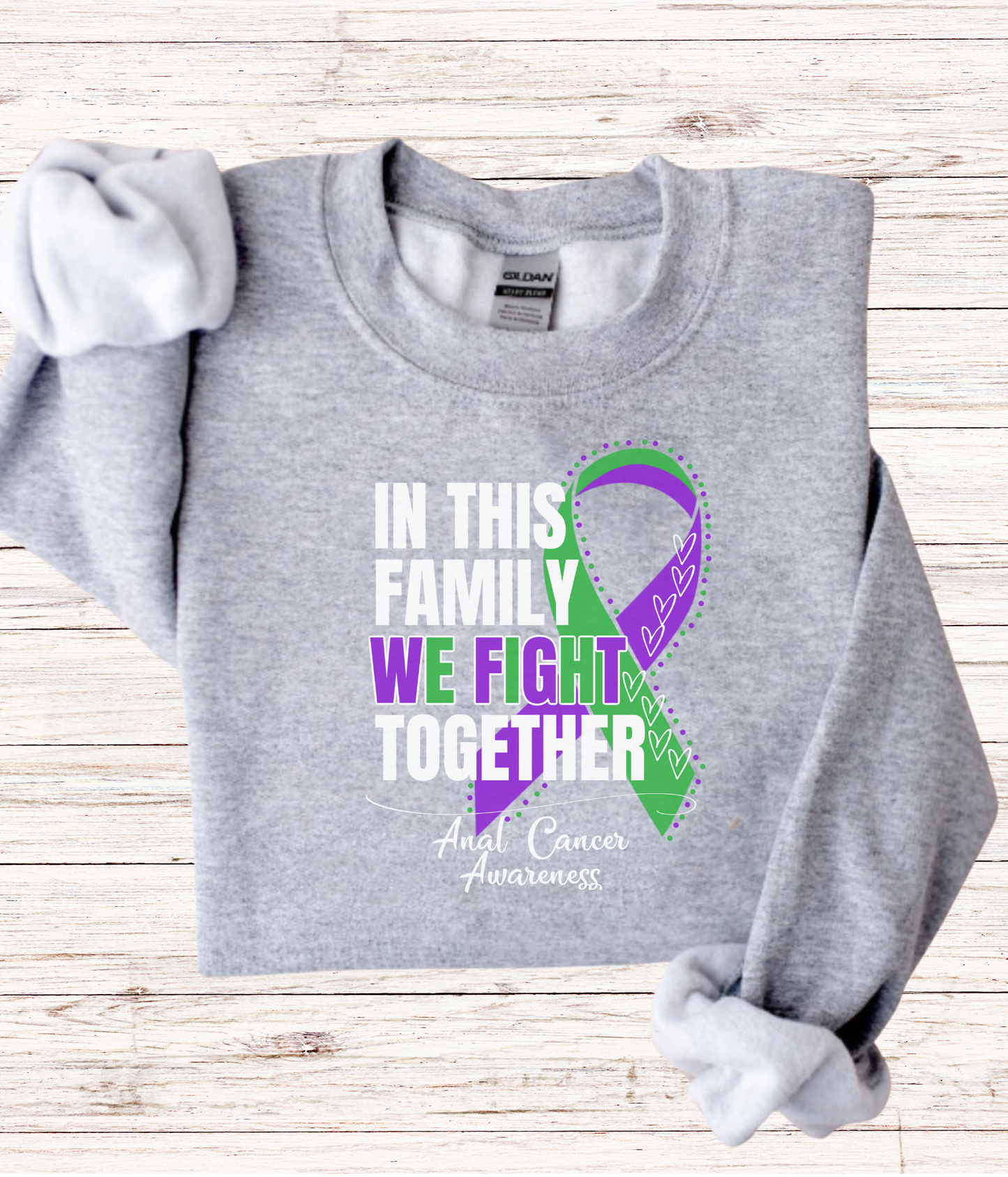 a gray shirt with a purple and green ribbon on it