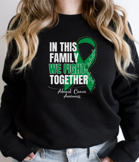 a woman wearing a black sweatshirt with a green ribbon in this family we fight together
