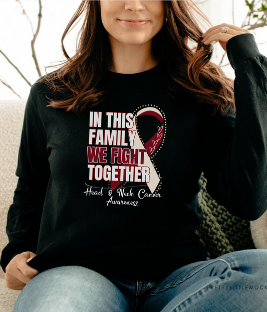 a woman sitting on a couch wearing a black shirt