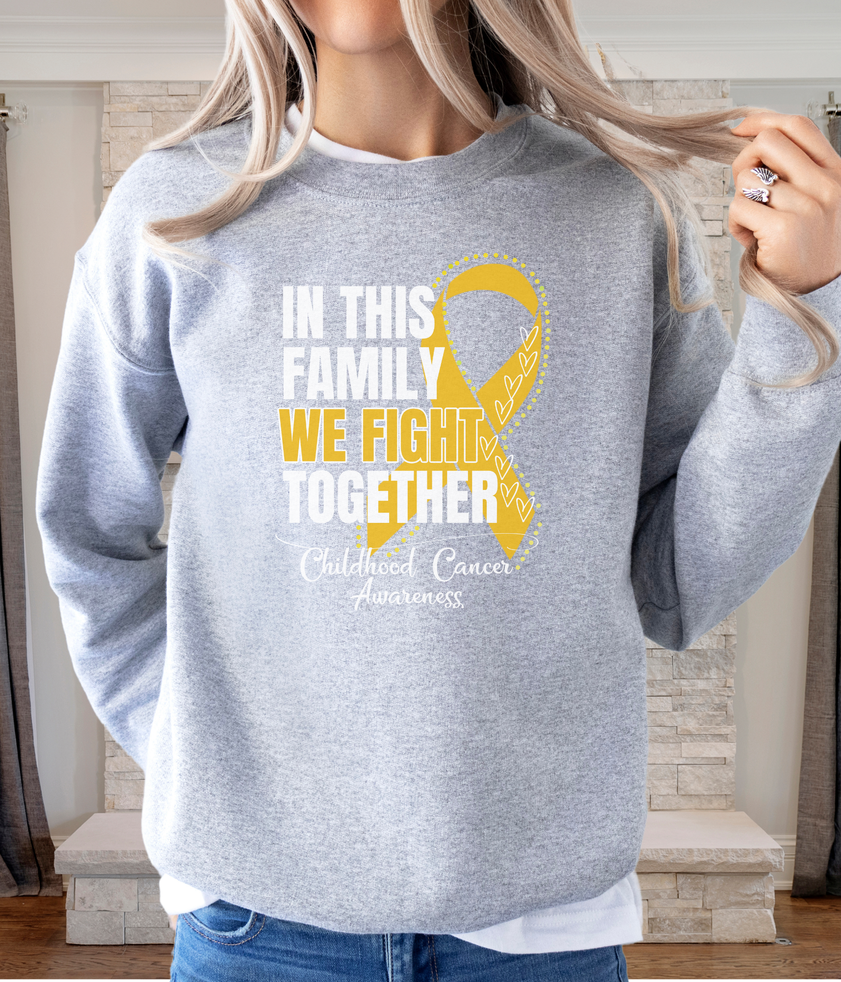 a woman wearing a sweatshirt with a yellow ribbon on it