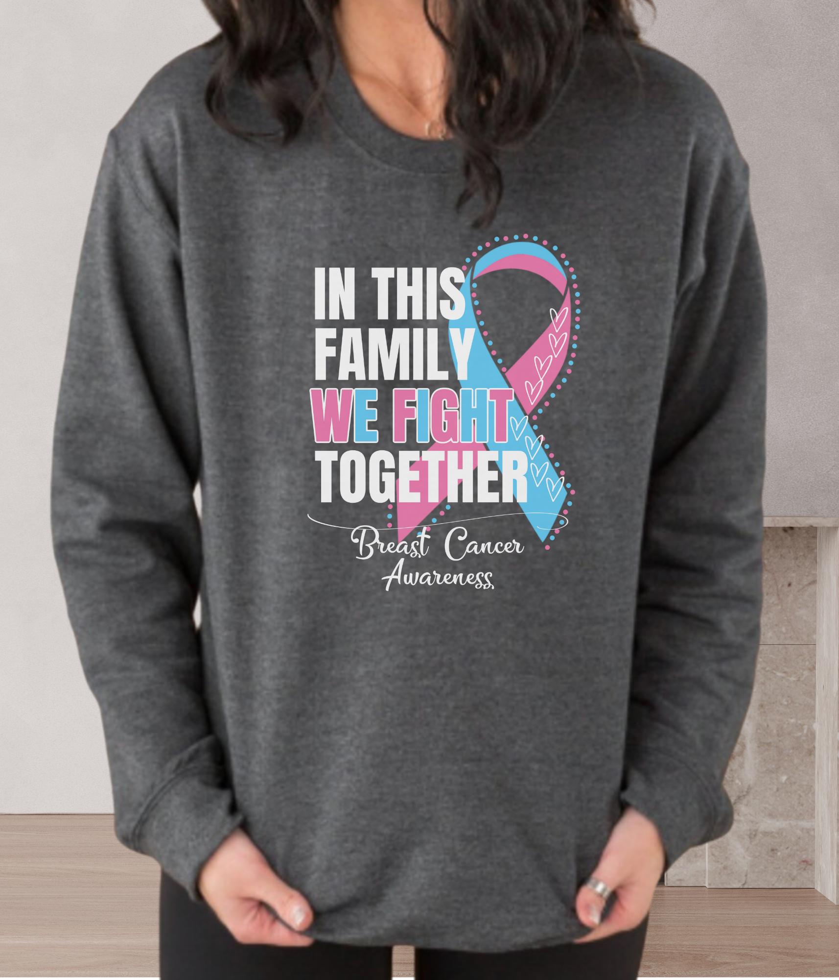 a woman wearing a sweatshirt that says in this family we fight together