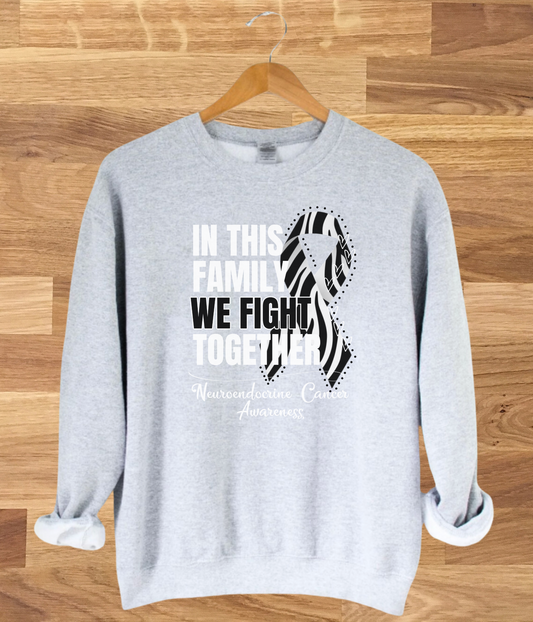 a grey sweatshirt with the words in this family we fight together
