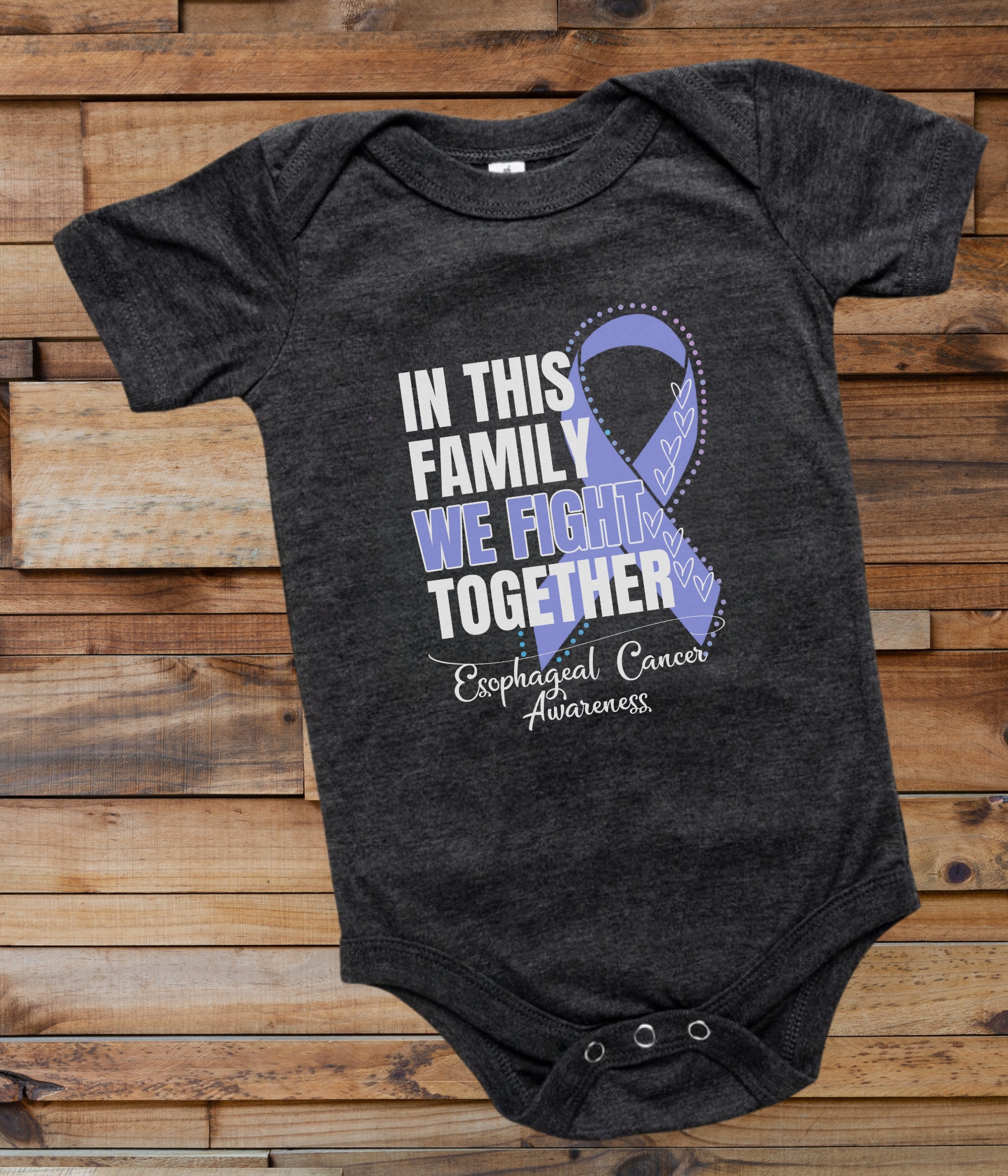 a black onesuit with a blue ribbon in this family we fight together