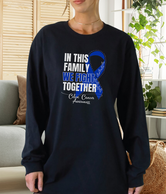 a woman wearing a black shirt with a blue ribbon in this family we fight together