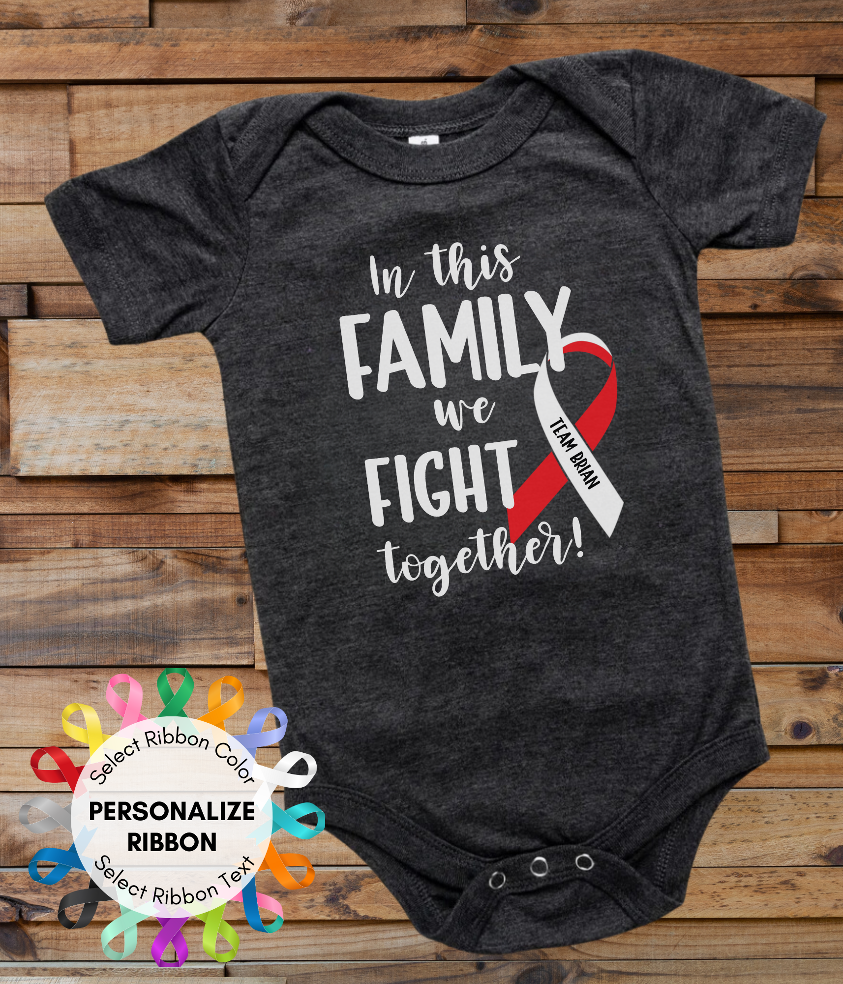 a black onesuit with a red and white ribbon in this family we fight together