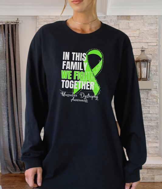 a woman wearing a black shirt with a green ribbon on it