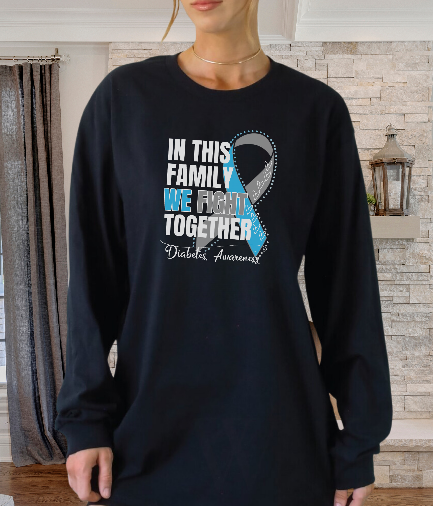 a woman wearing a black shirt with a blue ribbon in this family we fight together