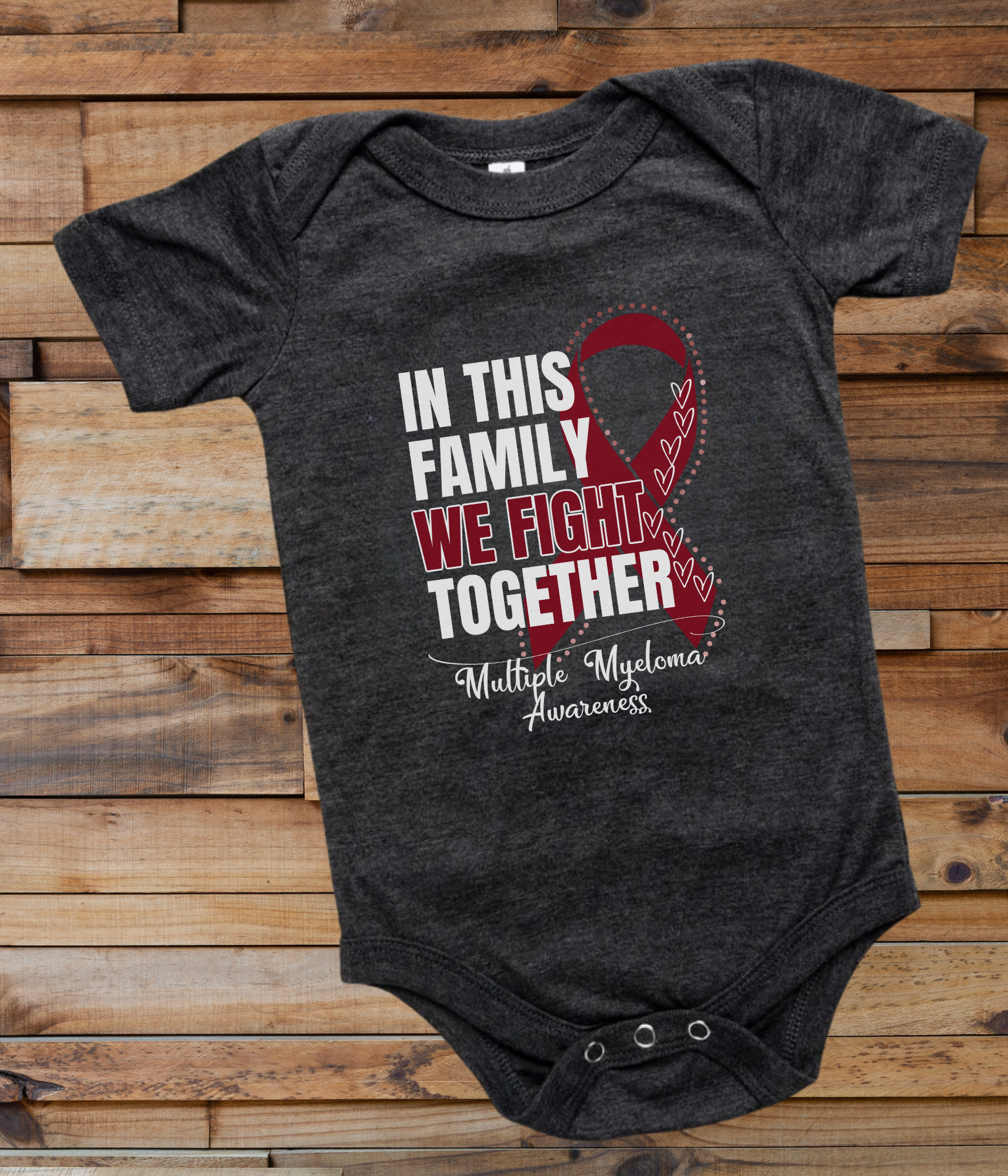 a black onesuit with a red ribbon in this family we fight together