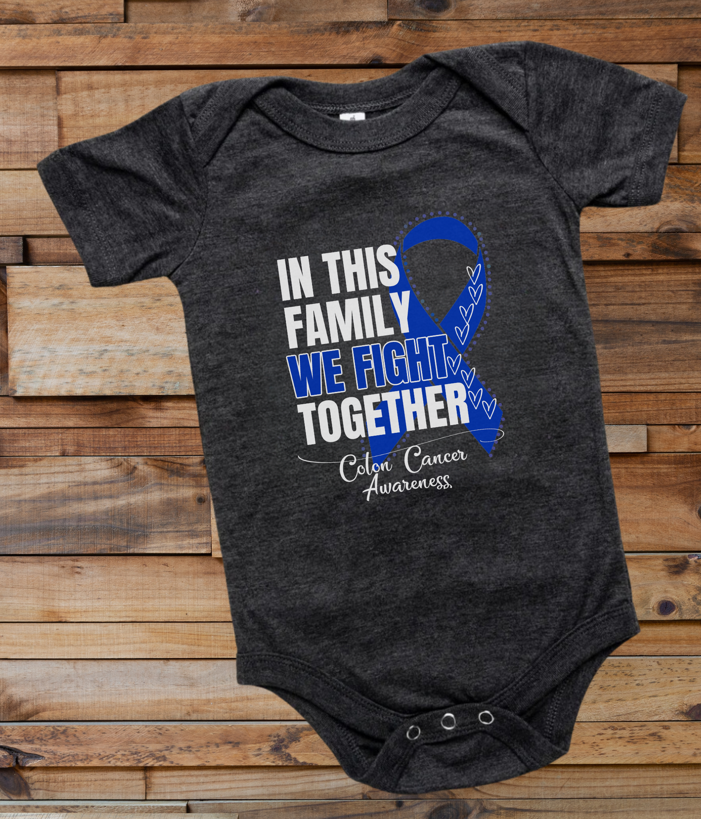 a black onesuit with a blue ribbon in this family we fight together