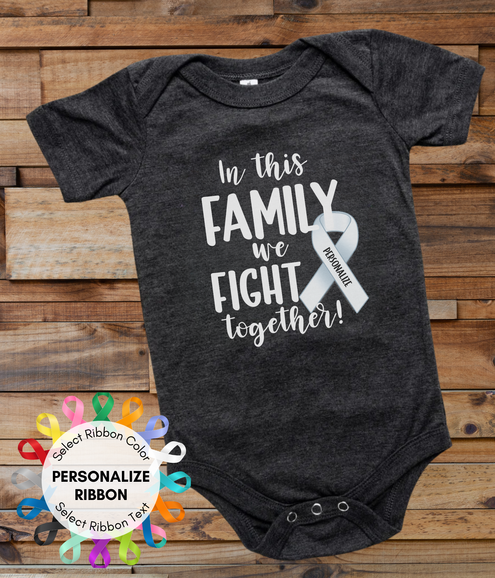 a black onesuit with a white ribbon on it and the words in this family