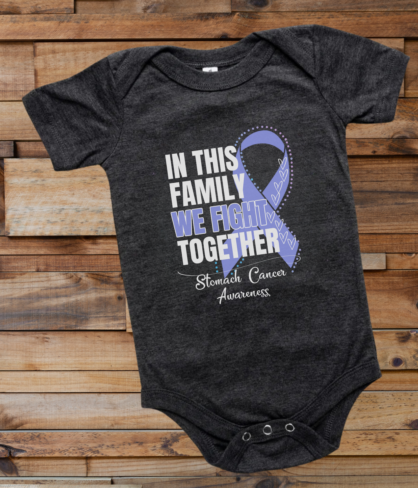 a black onesuit with a blue ribbon in this family we fight together