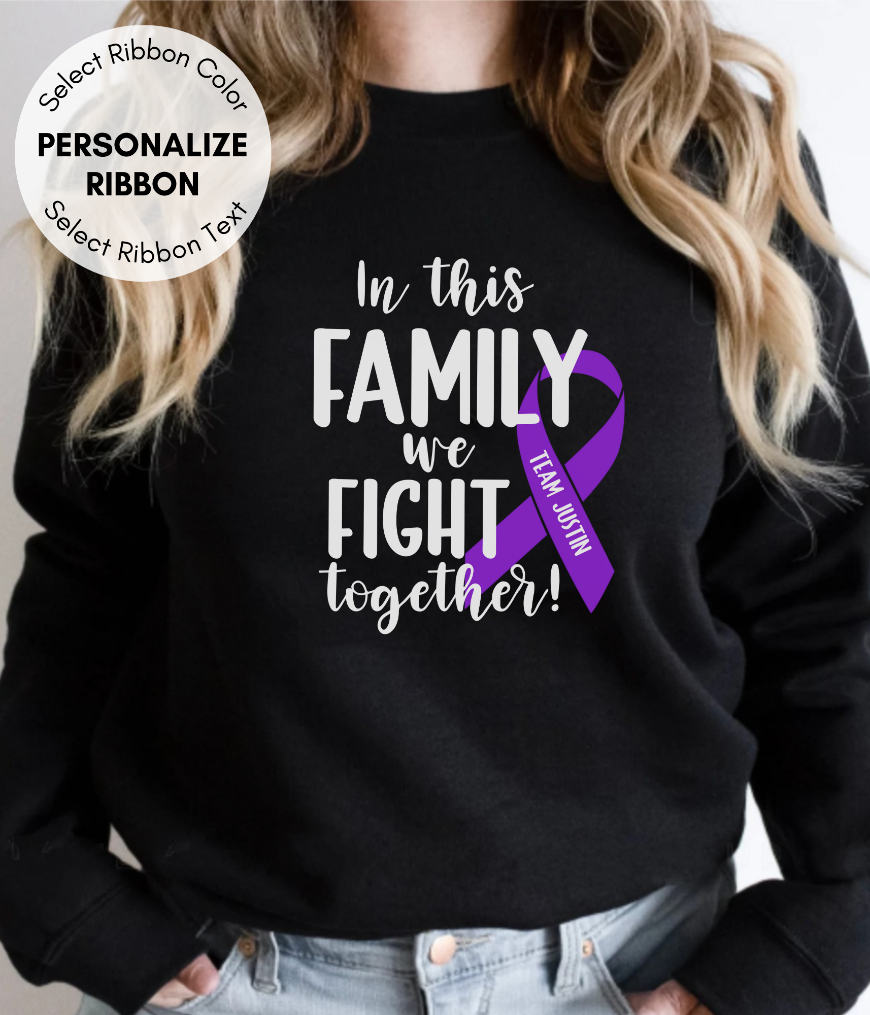 a woman wearing a black sweatshirt with a purple ribbon on it