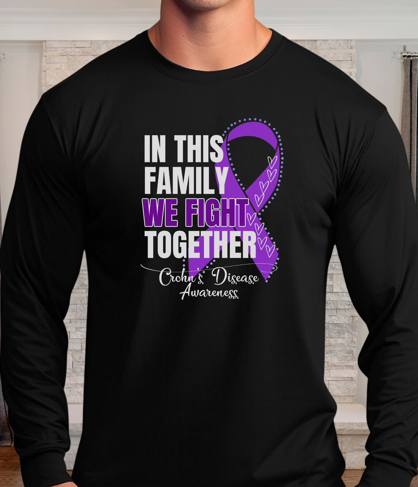 a man wearing a black shirt with a purple ribbon on it