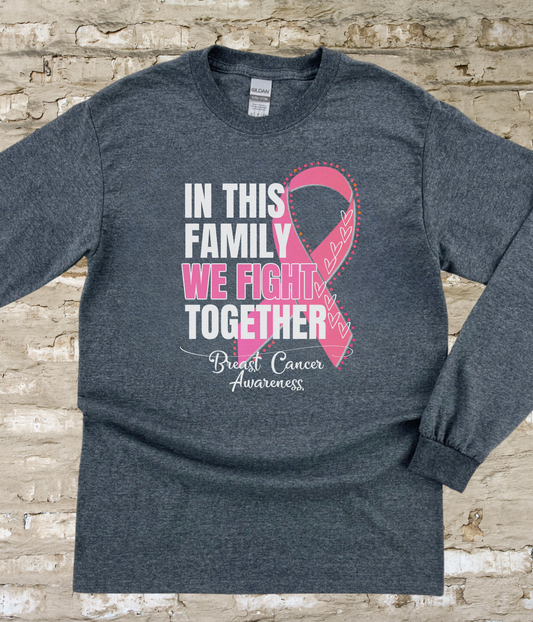 a t - shirt with a pink ribbon on it that says in this family we