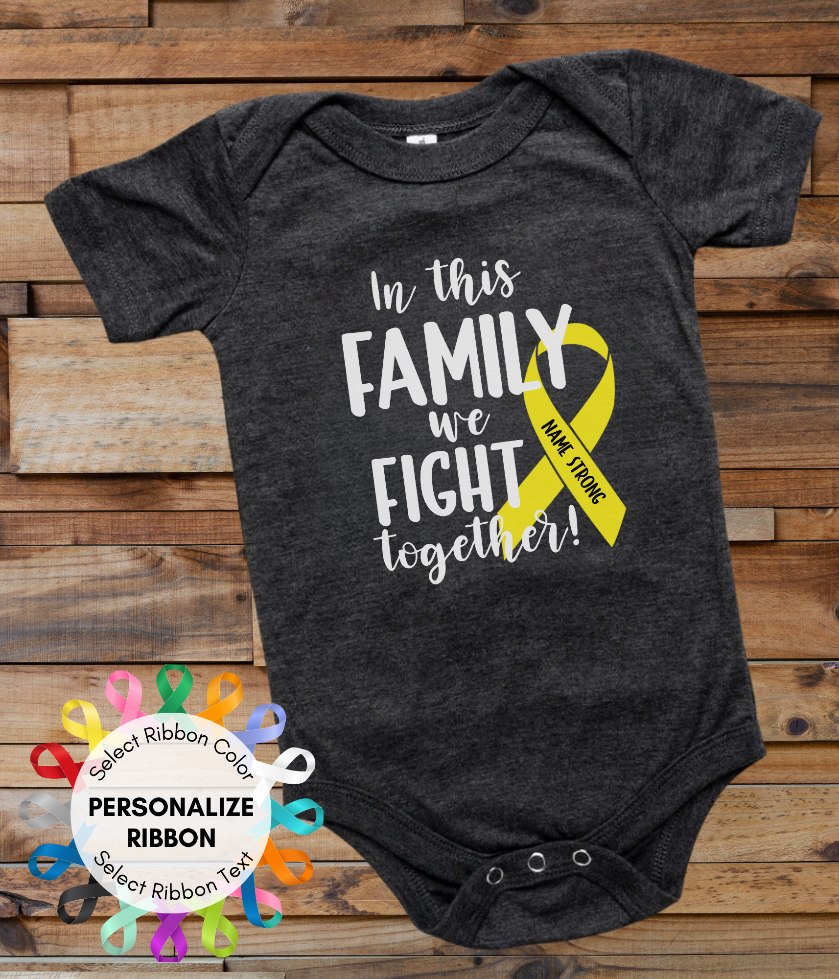 a black onesuit with a yellow ribbon that says in this family we fight together