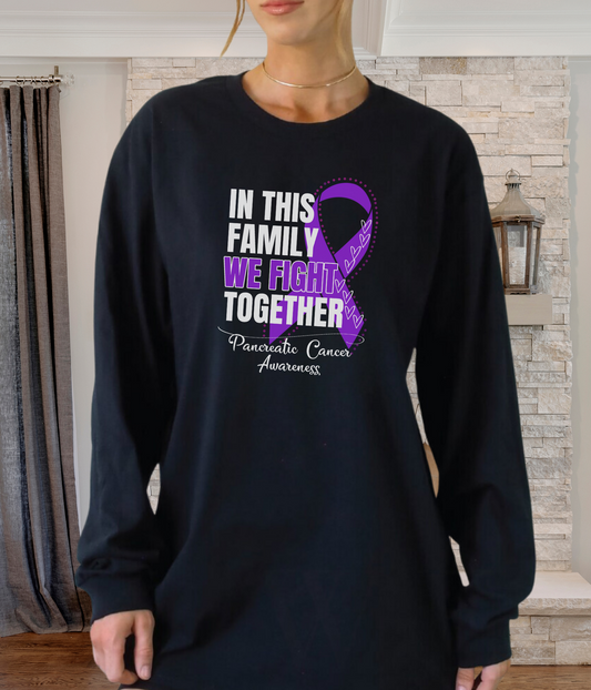 a woman wearing a black shirt with a purple ribbon on it