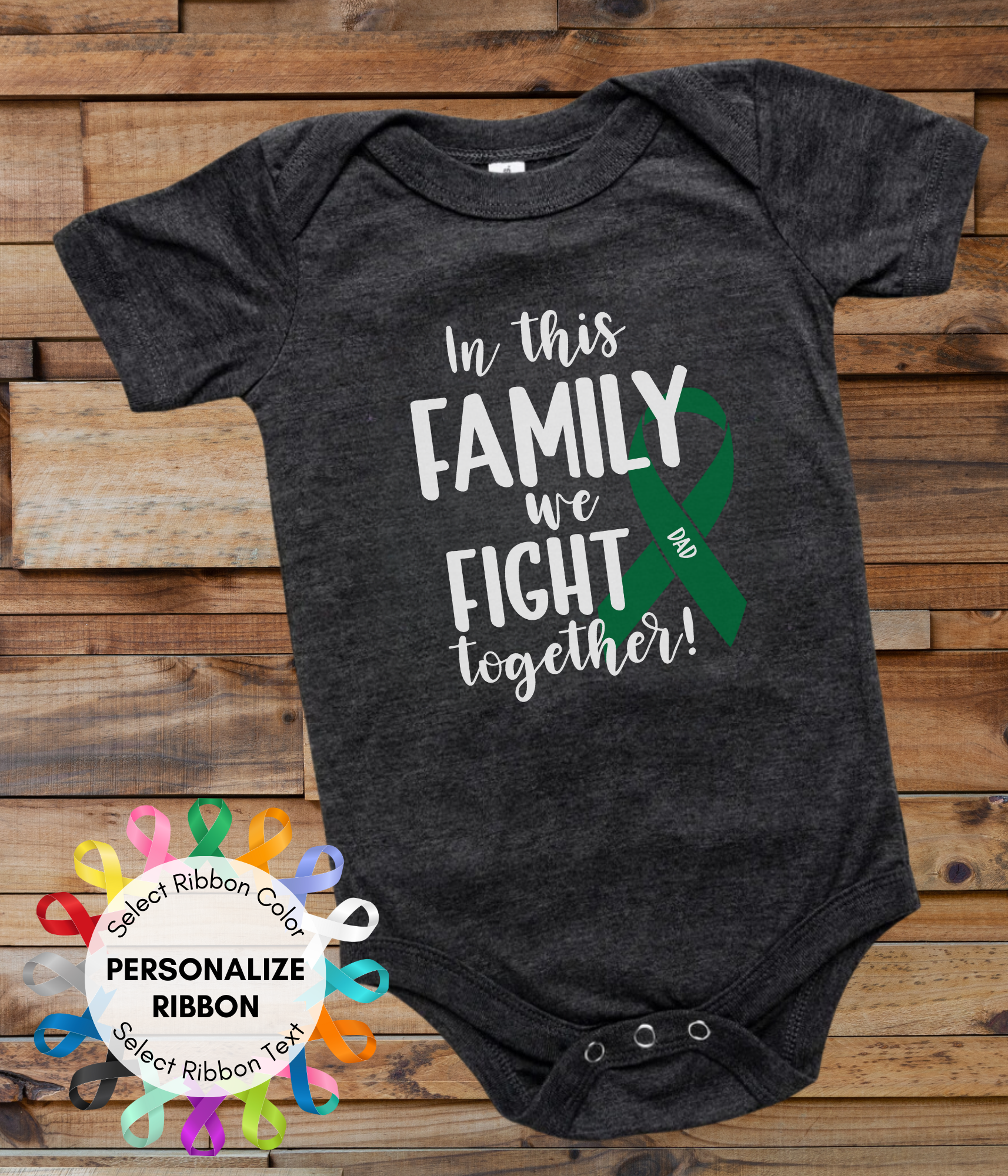 a black onesuit with a green ribbon that says in this family we fight together