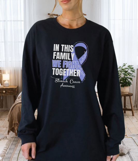 a woman wearing a t - shirt that says in this family we fight together
