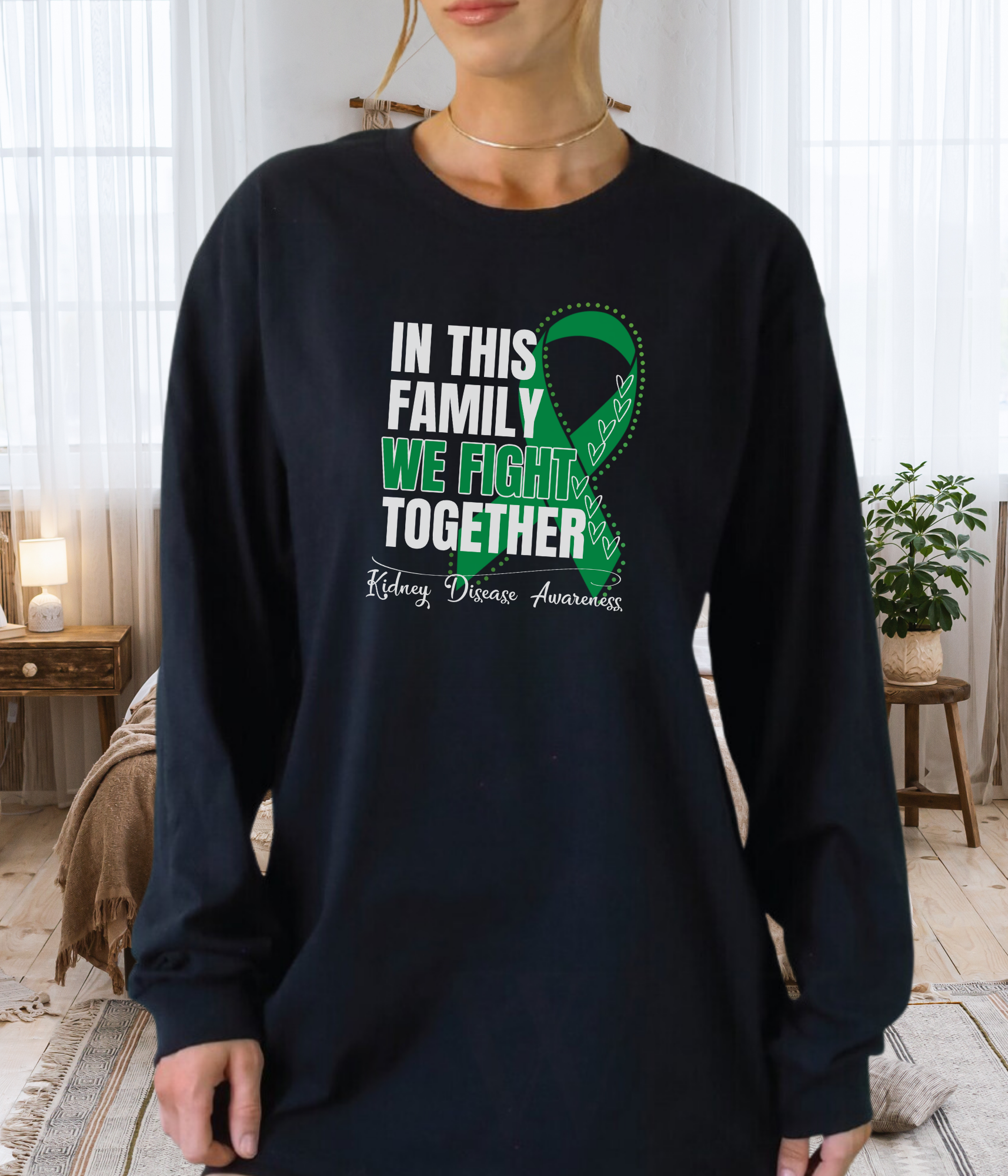 a woman wearing a black shirt with a green ribbon in this family we fight together