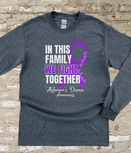 a t - shirt with a purple ribbon on it that says in this family we