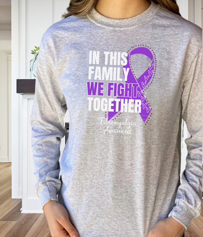 a woman wearing a t - shirt that says in this family we fight together